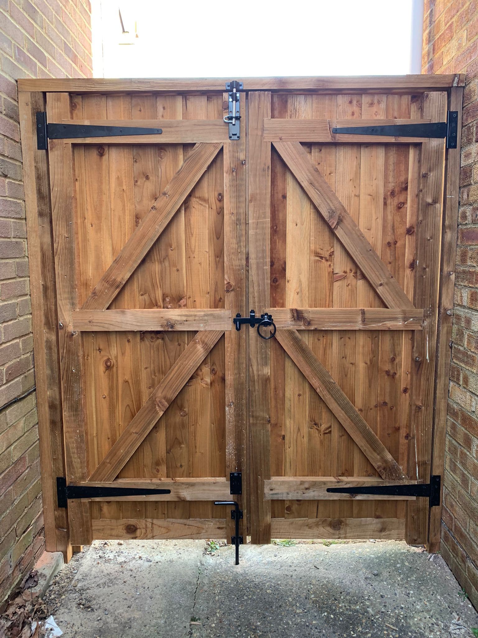 Double timber gates with iron hardware in Essex