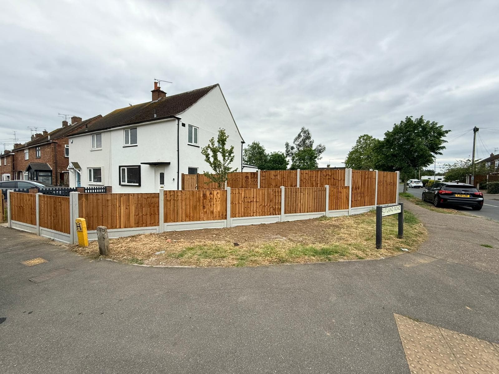 Closeboard fencing and gate line around a driveway in Essex