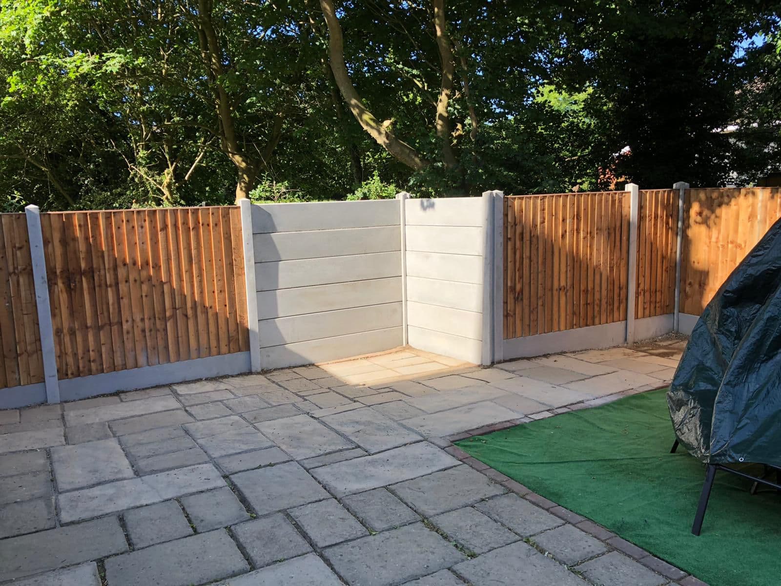 Decorative wave-top lattice fencing for a Writtle-style village garden